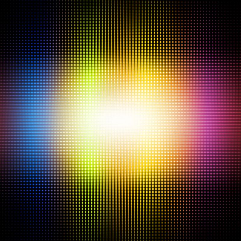 Blue, yellow, orange, and red dots with a bright white center on a black background