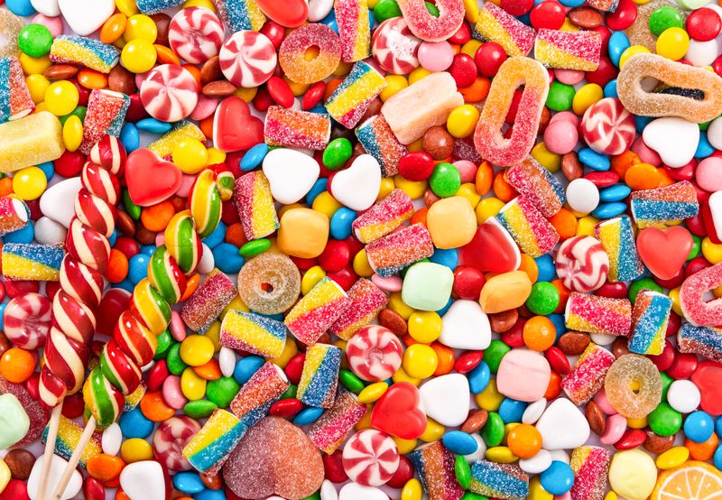 assorted jelly and hard candies and lollipops in a multitude of colours