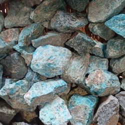 weathered olivine rocks (left); close up of the inside of a rotary kiln (right)