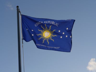 Flag of the Conch Republic (Key West) flying against a blue sky.