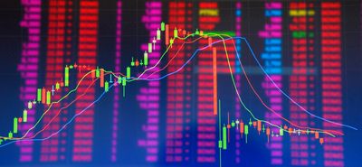 Double exposure Technical candlestick price chart showing up and down trend, volatility, panic sell, red selling stock ticker trading data on computer screen background Financial business concept