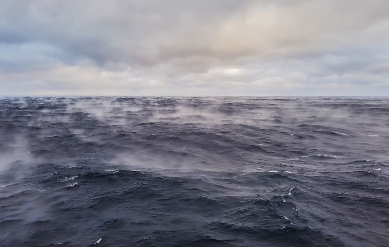 dark ocean with vapor rising from the surface