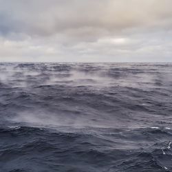 dark ocean with vapor rising from the surface