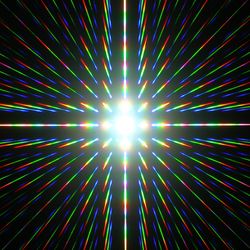 a lattice of light is visible in this picture. with little rainbows organizeds in the shape of a cross