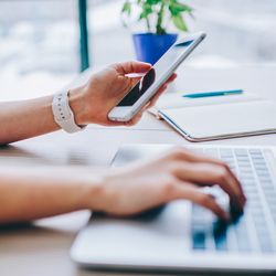 When flipping between phone and laptop, like this woman shown here, don't let the battery of either run so low it gets damaged.