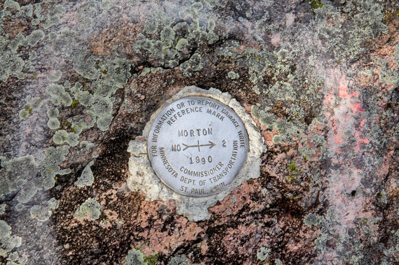 Metal Reference Mark #2 in Morton Gneiss Granite Rock - Morton County 1990 Minnesota Department of Transportation St. Paul, Minn
