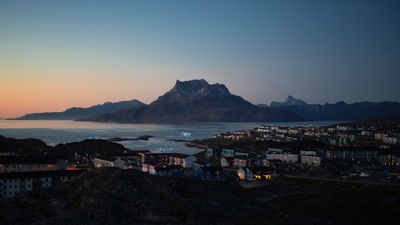 Sunsets over the capital of Nuuk in Greenland.