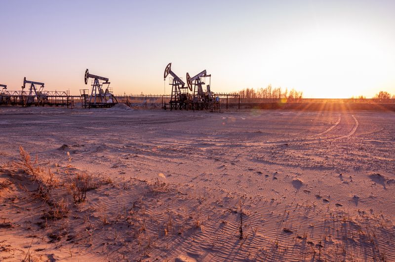Oil pump rig. Oil and gas production. Oilfield site.