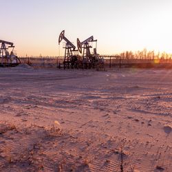 Oil pump rig. Oil and gas production. Oilfield site.