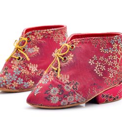 Red lotus shoes on a white background