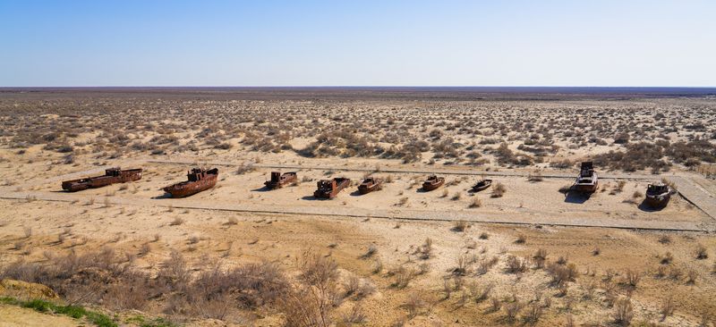 Rusty ships lying on the seabed of the dried-up Aral Sea in Moynaq (or Muynak), a former fishing town in Karakalpakstan, Uzbekistan