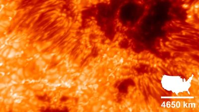 The full image of the sunspot revealed many bright cells around long thin darker structure around the dark potato shaped regions of the actual spots. Overlayed an image of the contiguous united states, showing that the size of the spot and how the US would fit five times across the whole image.