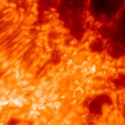 The full image of the sunspot revealed many bright cells around long thin darker structure around the dark potato shaped regions of the actual spots. Overlayed an image of the contiguous united states, showing that the size of the spot and how the US would fit five times across the whole image.