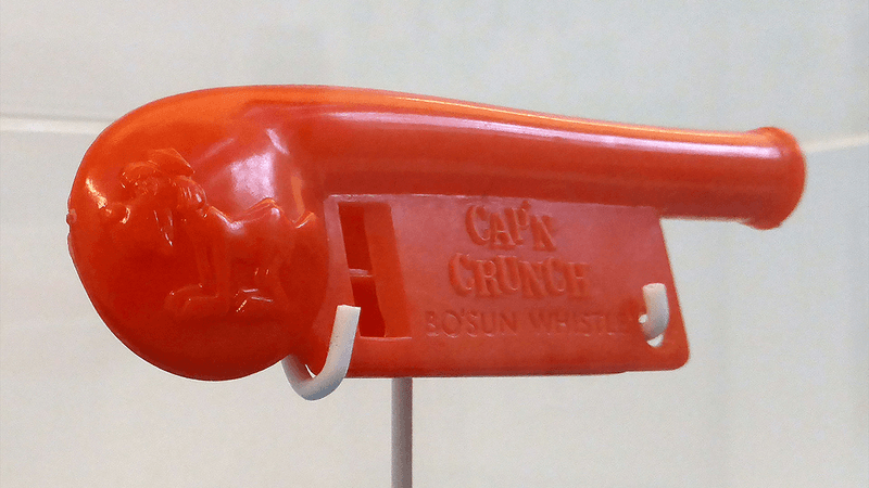 A plastic Cap'n Crunch whistle toy