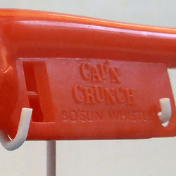 A plastic Cap'n Crunch whistle toy