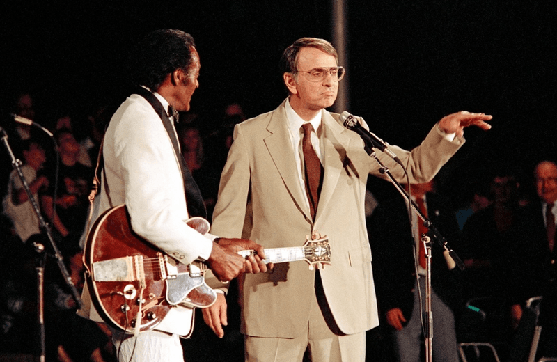Chuck Berry (left) and Carl Sagan (right) at a Voyager 2 Neptune flyby celebration in August 1989.