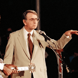 Chuck Berry (left) and Carl Sagan (right) at a Voyager 2 Neptune flyby celebration in August 1989.