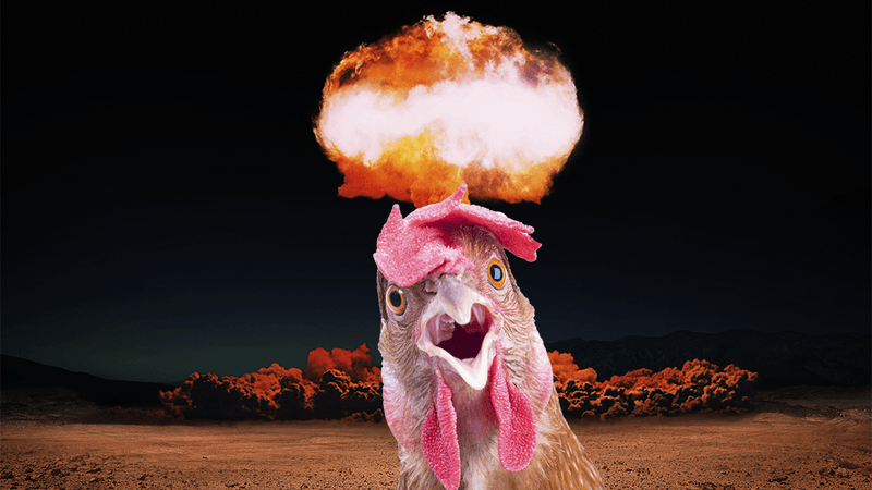 A chicken in front of a nuclear blast.