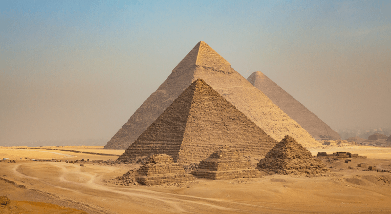 Egypt. Cairo - Giza. General view of pyramids from the Giza Plateau (three pyramids known as Queens' Pyramids on front side; next in order from left: the Pyramid of Menkaure, Khafre and Chufu