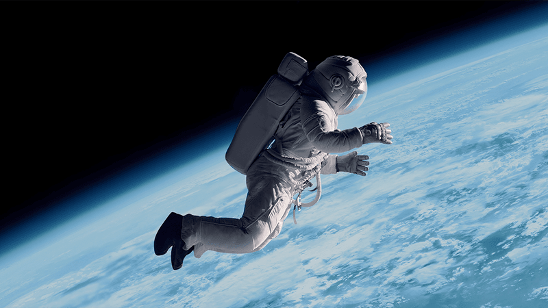 Astronaut floating above Earth (rendering).