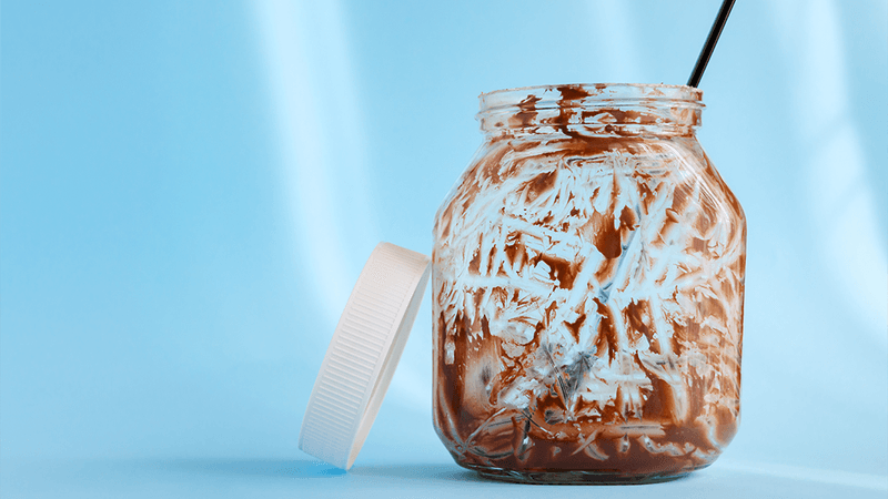 An empty jar of chocolate spread.