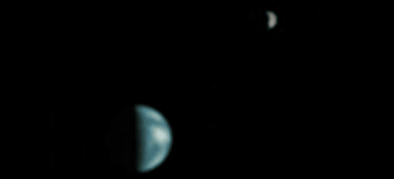 Earth and the Moon as seen from Martian orbit by NASA's NASA Global Surveyor. Note how only about half the side we can see is illuminated.