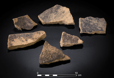 sherds of purple dye vats with purple dye remains