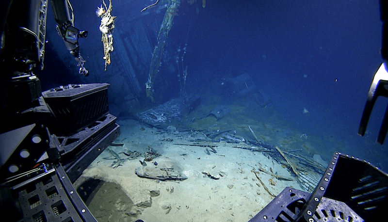 View of the automobile in the hangar of USS Yorktown upon approach during Dive 07 of the expedition. 