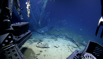 View of the automobile in the hangar of USS Yorktown upon approach during Dive 07 of the expedition. 