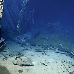 View of the automobile in the hangar of USS Yorktown upon approach during Dive 07 of the expedition. 