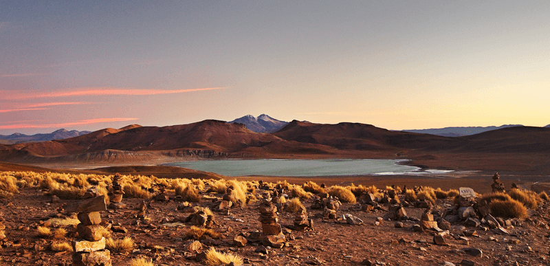 at sunset, the volcano Uturuncu, which means "jaguar" in the Quechua language, stands at height of 6,008 metres (19,711 feet) in southwestern Bolivia.