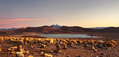 at sunset, the volcano Uturuncu, which means "jaguar" in the Quechua language, stands at height of 6,008 metres (19,711 feet) in southwestern Bolivia.