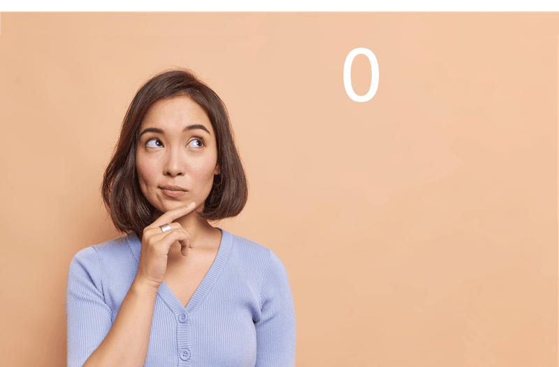 Woman staring throughtfully at the number zero