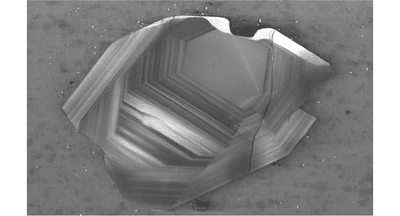A Jack Hills zircon around 200 micrometers across. Not only are these the oldest surviving crystals on the planet, they contain clues to what was there even before them.